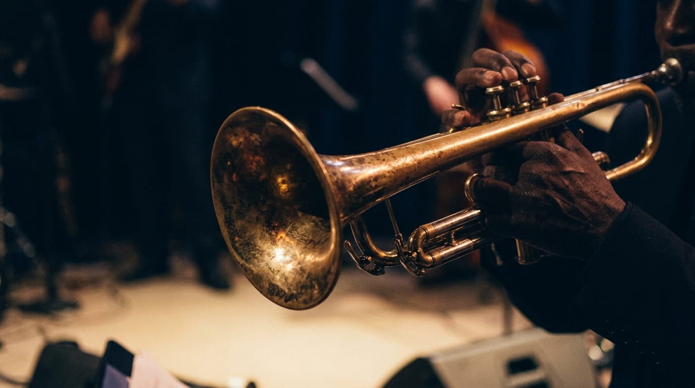 Jazz musician playing vintage brass trumpet on stage with warm spotlight lighting